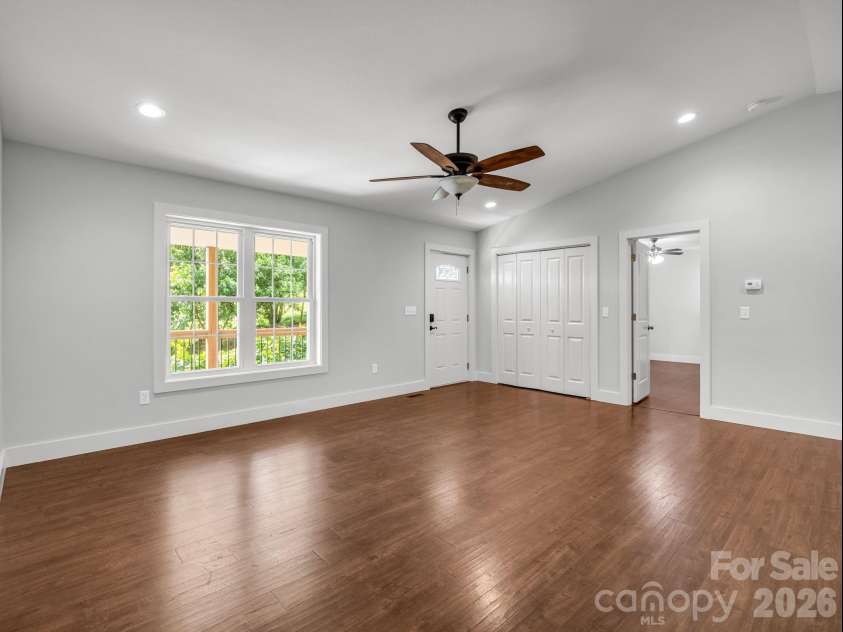 18 Old Chapman Place, Leicester, NC 28748.  MLS# CAR4398287, YatesRealty ID 33451. Living room & dining area
