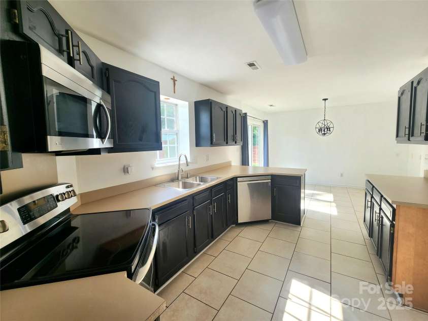 3108 Leicester Drive, Matthews, NC 28104.  MLS# CAR4273799, YatesRealty ID 33452. Kitchen - from Formal Dining Room Entrance