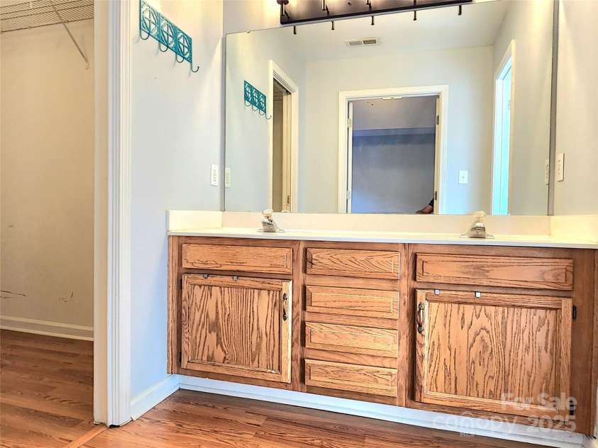 3108 Leicester Drive, Matthews, NC 28104.  MLS# CAR4273799, YatesRealty ID 33452. Primary Bedroom Walk-In Closet and Sink Area