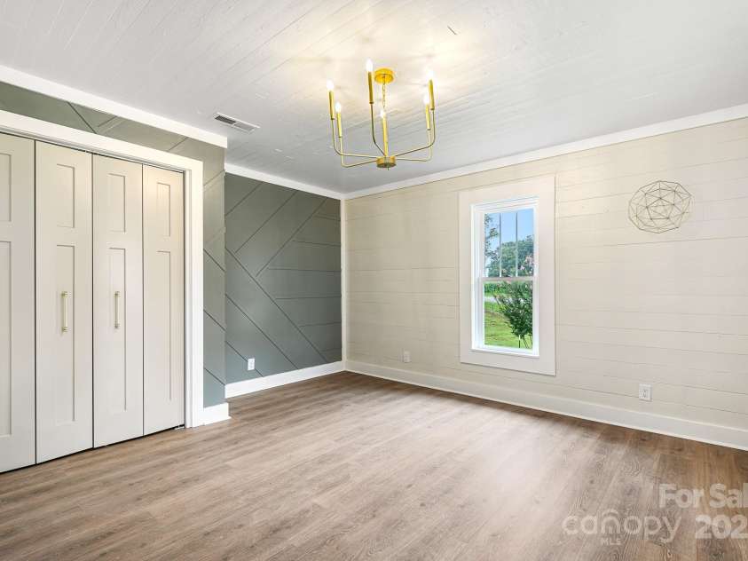 271 Fairmount Road, Statesville, NC 28625.  MLS# CAR4284489, YatesRealty ID 33455. Front bedroom with custom closet doors and accent wall