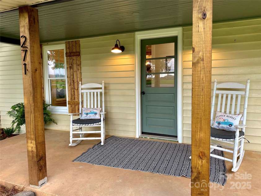 271 Fairmount Road, Statesville, NC 28625.  MLS# CAR4284489, YatesRealty ID 33455. Rocking chair front porch
