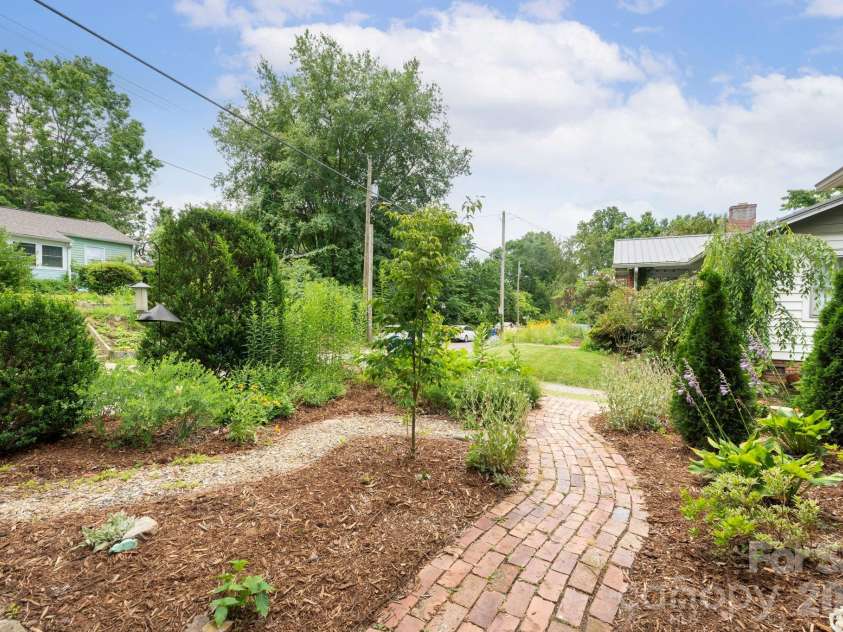 15 Westgate Road, Asheville, NC 28806.  MLS# CAR4397245, YatesRealty ID 33456. Brick Paths Meander Through Freshly-Mulched Beds