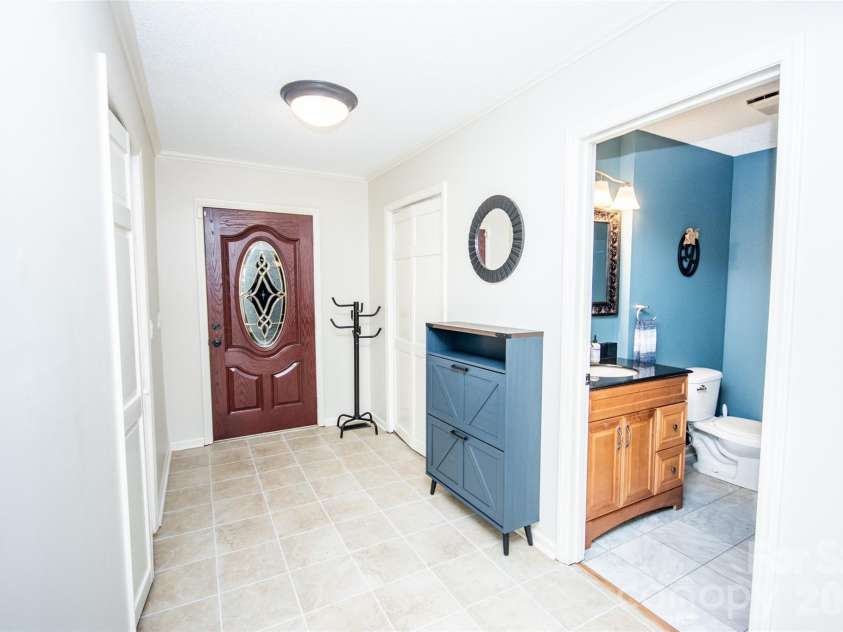 2193 Hawthorne Lane, Wilkesboro, NC 28697.  MLS# CAR4325511, YatesRealty ID 3346. Hall to half bath, laundry/mud room & garage