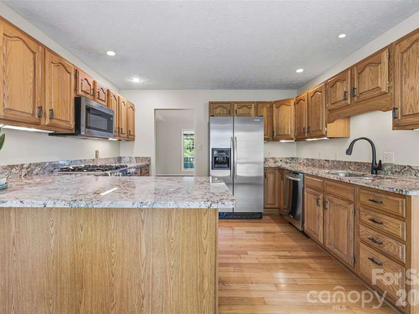 279 Woody Lane, Asheville, NC 28804.  MLS# CAR4392682, YatesRealty ID 33463. Spacious kitchen designed for everyday functionality and entertaining.