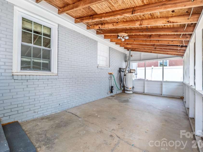 2113 Scott Avenue, Charlotte, NC 28203.  MLS# CAR4393437, YatesRealty ID 33471. Covered back porch area