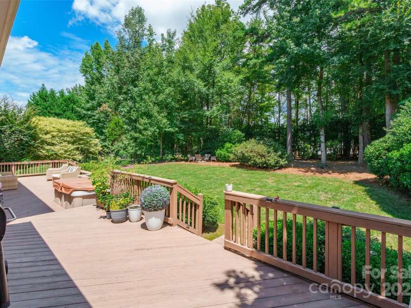 10009 Devonshire Drive, Huntersville, NC 28078.  MLS# CAR4292222, YatesRealty ID 33475. Huge deck onto beautiful tree back yard