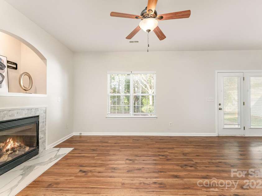 11516 Heritage Green Drive, Cornelius, NC 28031.  MLS# CAR4289684, YatesRealty ID 33480. Large Family room space with cozy fireplace
