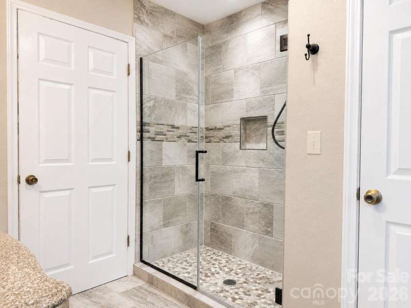 552 Coxes Creek Church Road, Marion, NC 28752.  MLS# CAR4398247, YatesRealty ID 33482. Master Bath Shower