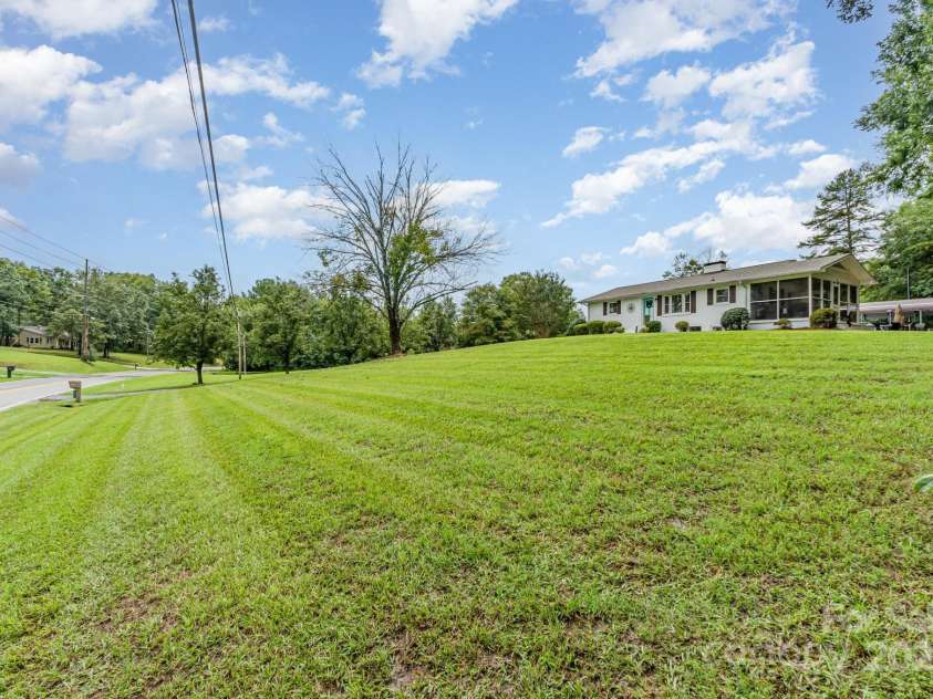 4206 Flowes Store Road, Concord, NC 28025.  MLS# CAR4291656, YatesRealty ID 33486. Front yard view from Flowes Store Road