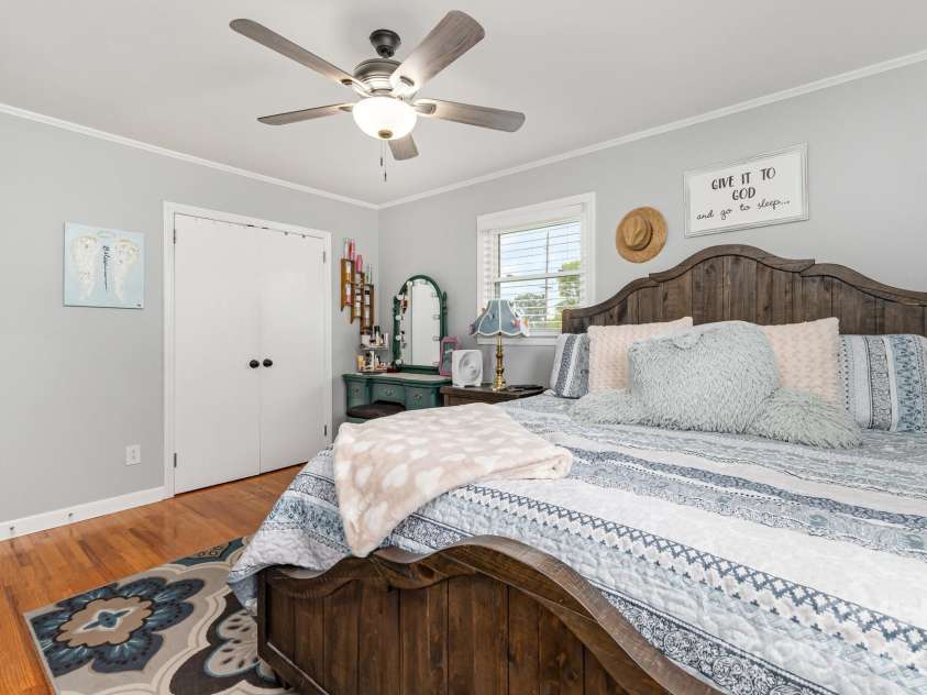 4206 Flowes Store Road, Concord, NC 28025.  MLS# CAR4291656, YatesRealty ID 33486. Primary bedroom also has original hardwoods and overhead ceiling fan.