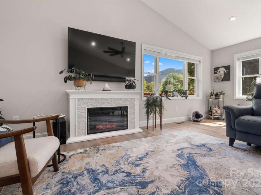 118 Rolling Lane, Maggie Valley, NC 28751.  MLS# CAR4303888, YatesRealty ID 33489. Fireplace in the center of the great room