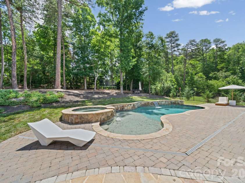 163 Monteray Oaks Circle, Fort Mill, SC 29715.  MLS# CAR4386895, YatesRealty ID 33489. Pool w/sunshelf