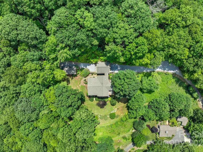 147 Brantley Branch Lane, Waynesville, NC 28786.  MLS# CAR4275100, YatesRealty ID 3349. 3+ acres of lush mature grounds