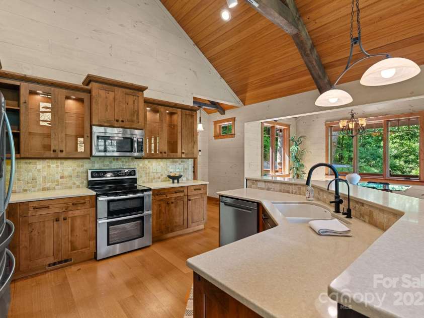 147 Brantley Branch Lane, Waynesville, NC 28786.  MLS# CAR4275100, YatesRealty ID 3349. Knotty Alder whiskey-glazed cabinets 