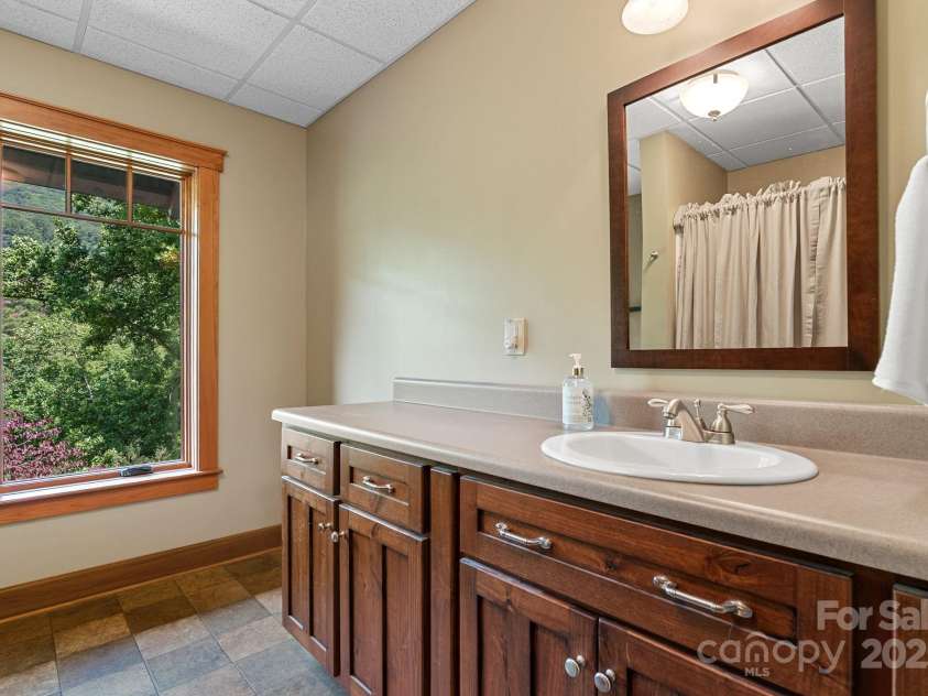 147 Brantley Branch Lane, Waynesville, NC 28786.  MLS# CAR4275100, YatesRealty ID 3349. Lower level bathroom
