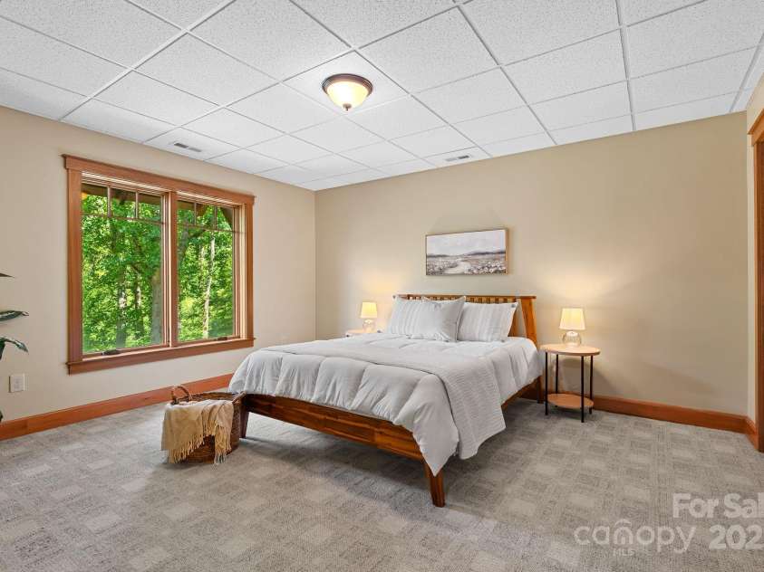 147 Brantley Branch Lane, Waynesville, NC 28786.  MLS# CAR4275100, YatesRealty ID 3349. Lower-level bedroom is full daylight
