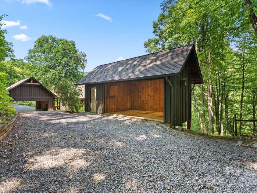 147 Brantley Branch Lane, Waynesville, NC 28786.  MLS# CAR4275100, YatesRealty ID 3349. Open storage shed with enclosed gardened shed