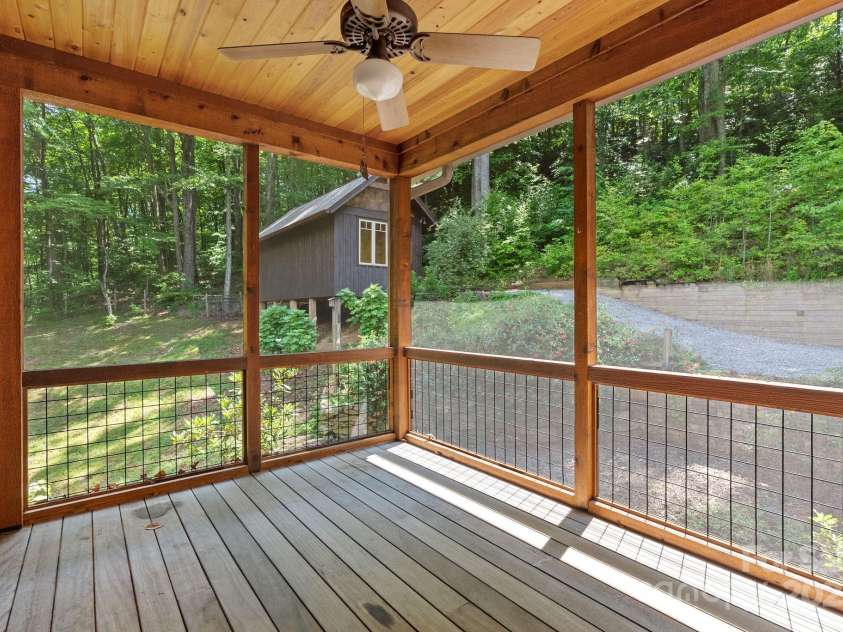 147 Brantley Branch Lane, Waynesville, NC 28786.  MLS# CAR4275100, YatesRealty ID 3349. Screened-in porch