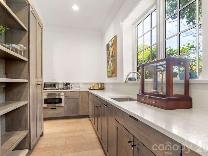 1355 Kings Drive, Charlotte, NC 28207.  MLS# CAR4391517, YatesRealty ID 33496. Scullery with counter top prep space and storage