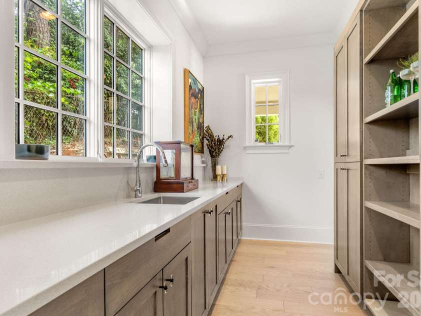 1355 Kings Drive, Charlotte, NC 28207.  MLS# CAR4391517, YatesRealty ID 33496. Scullery with counter top prep space and storage