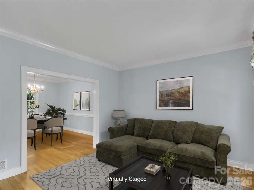 9 Hickory Ridge, Fletcher, NC 28732.  MLS# CAR4395833, YatesRealty ID 33500. Virtually staged sitting room looking into dining room
