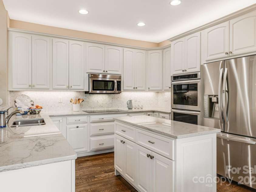 930 Sunlight Ridge Drive, Hendersonville, NC 28792.  MLS# CAR4281569, YatesRealty ID 33501. Amble Storage Space, Kitchen Island and Breakfast Bar