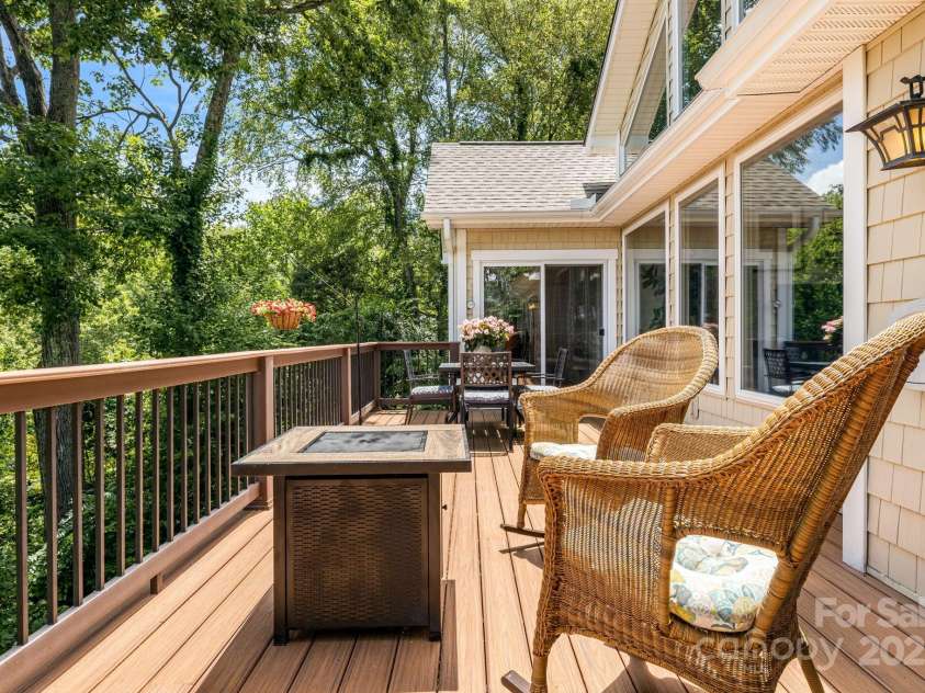 930 Sunlight Ridge Drive, Hendersonville, NC 28792.  MLS# CAR4281569, YatesRealty ID 33501. Entertain on the Spacious Deck