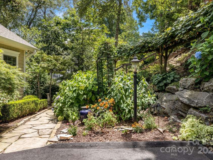 930 Sunlight Ridge Drive, Hendersonville, NC 28792.  MLS# CAR4281569, YatesRealty ID 33501. Perennial Gardens