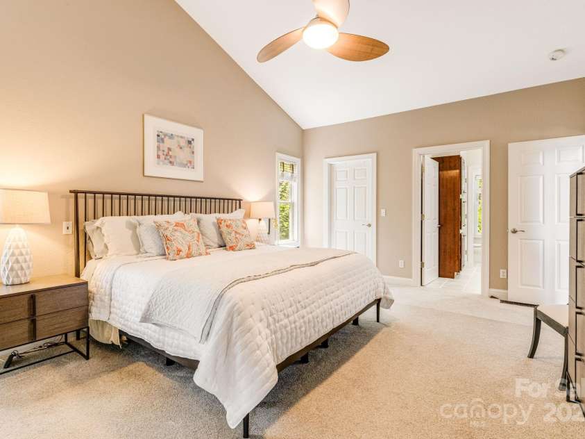 930 Sunlight Ridge Drive, Hendersonville, NC 28792.  MLS# CAR4281569, YatesRealty ID 33501. Primary Suite, vaulted ceilings, spacious walk-in closet and updated bathroom