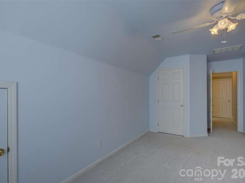 11611 Knightsdale Drive, Charlotte, NC 28277.  MLS# CAR4393388, YatesRealty ID 33502. Bedroom 3 with closet and storage areas.
