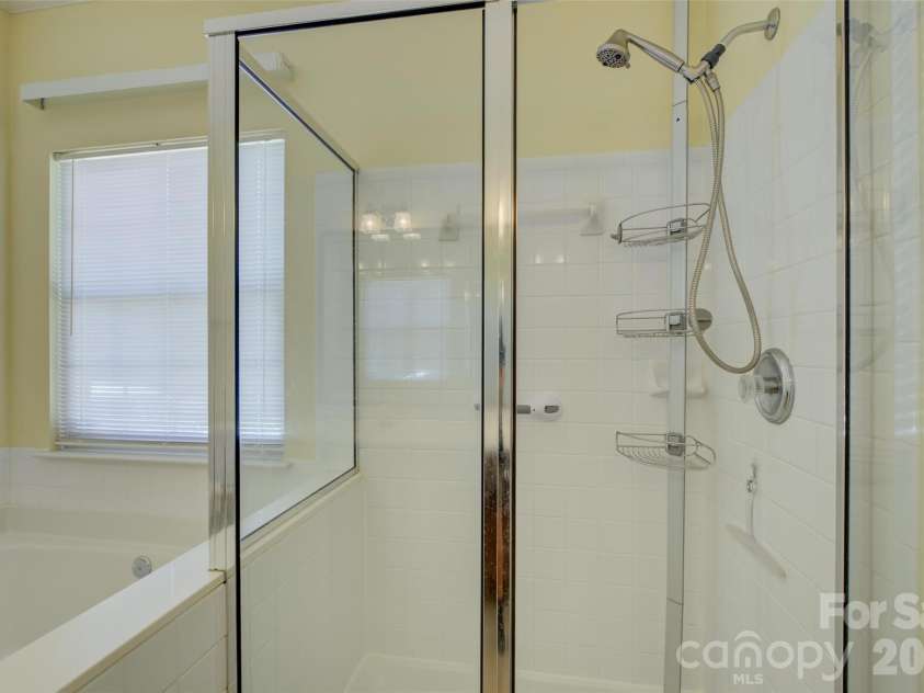 11611 Knightsdale Drive, Charlotte, NC 28277.  MLS# CAR4393388, YatesRealty ID 33502. Corner shower with glass enclosure.