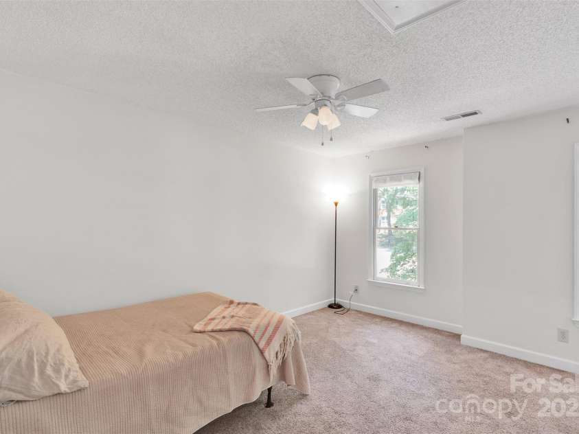 2725 Kirkholm Drive, Matthews, NC 28105.  MLS# CAR4280799, YatesRealty ID 33503. Secondary bedroom