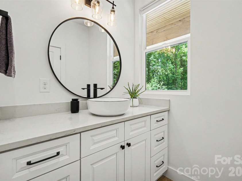 8208 New Town Road, Waxhaw, NC 28173.  MLS# CAR4382705, YatesRealty ID 33507. Half bath downstairs