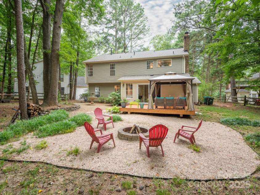 3102 Peggy Ridge Terrace, Matthews, NC 28105.  MLS# CAR4278546, YatesRealty ID 33508. Backyard w/ firepit