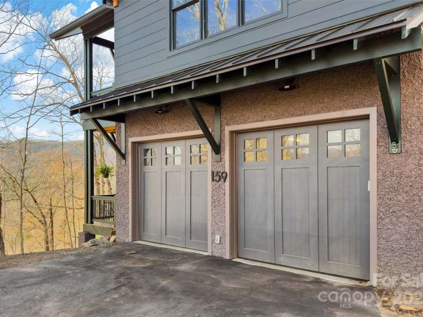 159 Settings Boulevard, Black Mountain, NC 28711.  MLS# CAR4237970, YatesRealty ID 3351. Driveway into 2-car garage