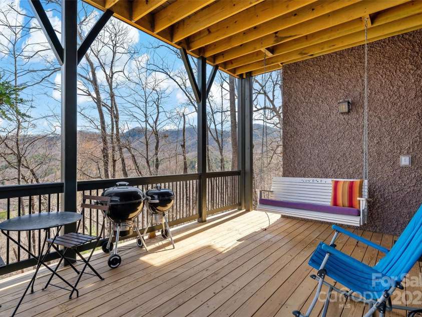 159 Settings Boulevard, Black Mountain, NC 28711.  MLS# CAR4237970, YatesRealty ID 3351. Porch connected to basement shop