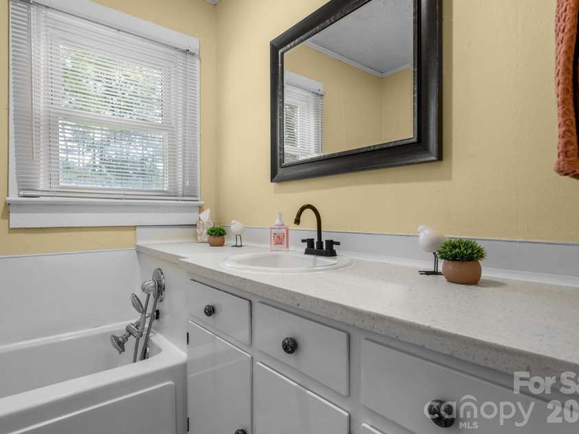 111 Cross Memorial Avenue, Morganton, NC 28655.  MLS# CAR4395304, YatesRealty ID 33511. Large vanity and good storage.