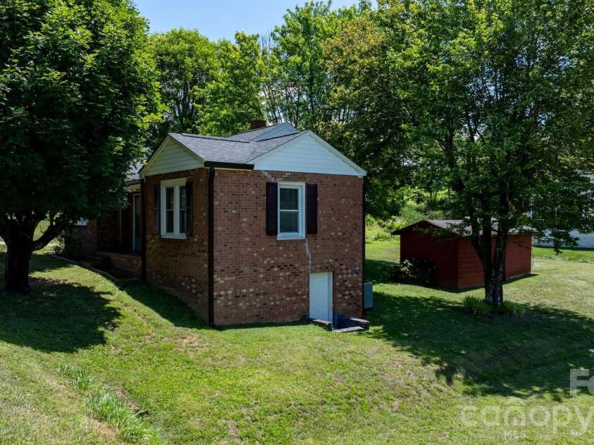 111 Cross Memorial Avenue, Morganton, NC 28655.  MLS# CAR4395304, YatesRealty ID 33511. Side view with partial basement access.