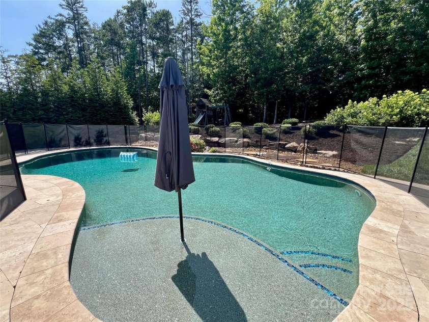 1906 Pensco Pond Court, Waxhaw, NC 28173.  MLS# CAR4266619, YatesRealty ID 33515. Saltwater Pool with Pebbletec surface and safety fence