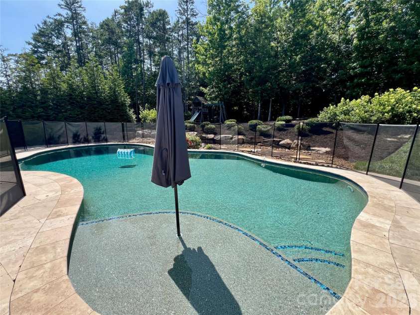1906 Pensco Pond Court, Waxhaw, NC 28173.  MLS# CAR4266619, YatesRealty ID 33515. Saltwater Pool with Pebbletec surface and safety fence