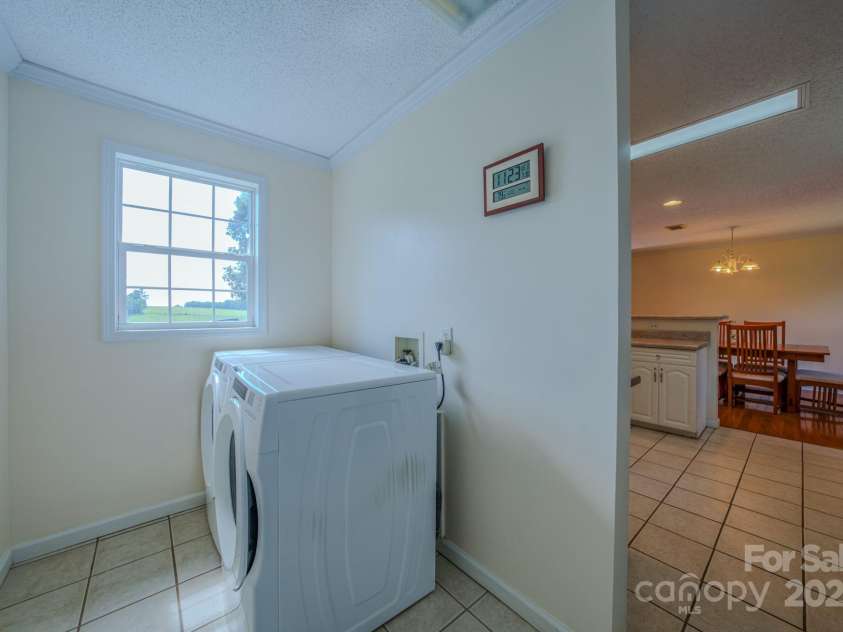 2606 Bear Creek Road, Marshall, NC 28753.  MLS# CAR4287238, YatesRealty ID 33517. Front Loading Washer and Dryer off side entrance