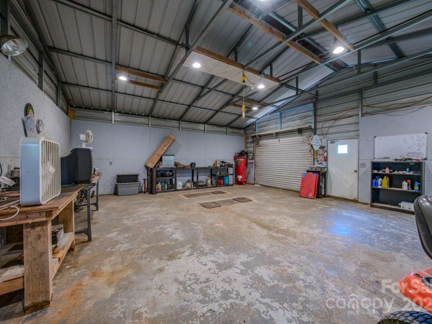 2606 Bear Creek Road, Marshall, NC 28753.  MLS# CAR4287238, YatesRealty ID 33517. Workshop Interior with work benches
