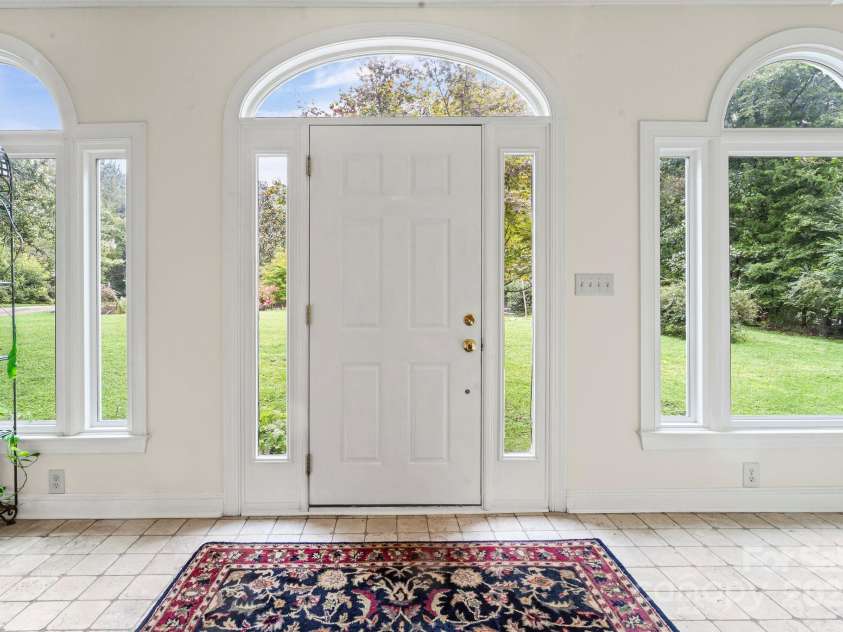 1112 Carole Court, Matthews, NC 28104.  MLS# CAR4274714, YatesRealty ID 33522. Front entry sunroom