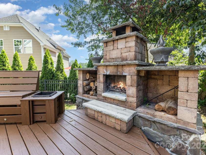 10120 Roosevelt Drive, Huntersville, NC 28078.  MLS# CAR4271359, YatesRealty ID 33526. Backyard Custom Fireplace -perfect for entertaining