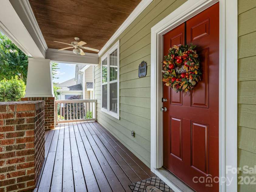 10120 Roosevelt Drive, Huntersville, NC 28078.  MLS# CAR4271359, YatesRealty ID 33526. Welcoming rocking chair covered front porch