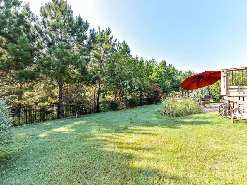 1619 Tranquility Boulevard, Lancaster, SC 29720.  MLS# CAR4289750, YatesRealty ID 33527. Rear Yard Fenced with Views of Tall Mature Trees