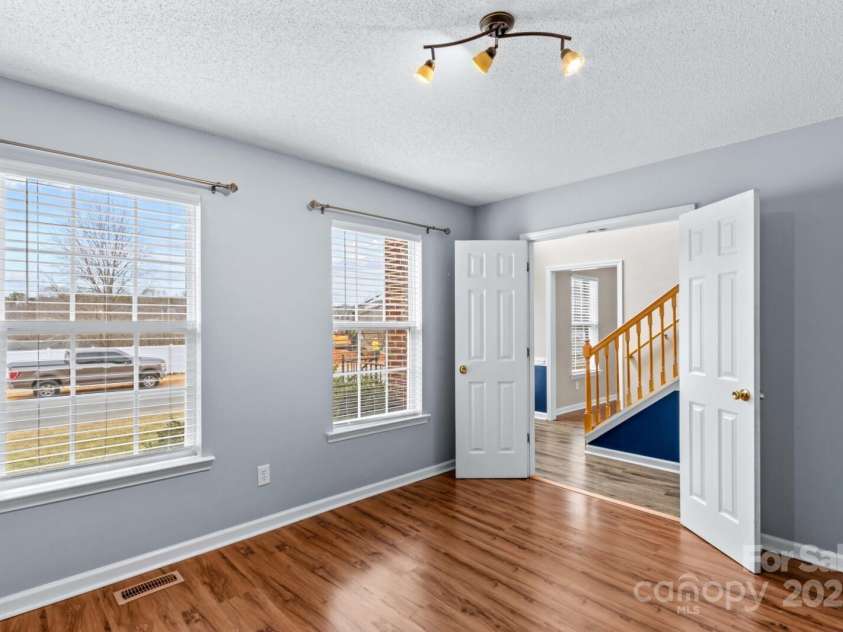 105 Secretariat Lane, Mooresville, NC 28117.  MLS# CAR4285718, YatesRealty ID 33528. Either can be used as a Office or a Den/playroom on the first floor .