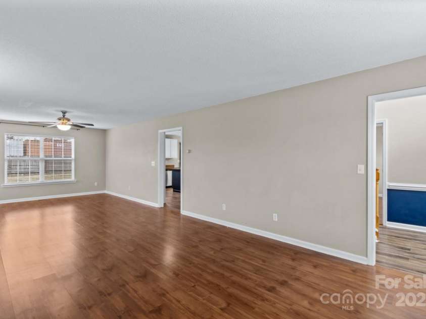 105 Secretariat Lane, Mooresville, NC 28117.  MLS# CAR4285718, YatesRealty ID 33528. Oversized Living room with a fireplace .