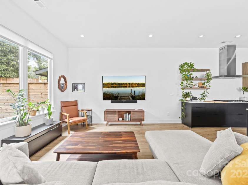 102 Mattoon Street, Charlotte, NC 28216.  MLS# CAR4291152, YatesRealty ID 33532. Enjoy natural light and your private backyard from the ENORMOUS casement windows.. Look at how happy these plants are!