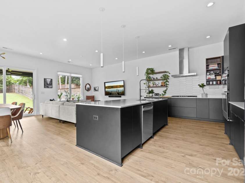 102 Mattoon Street, Charlotte, NC 28216.  MLS# CAR4291152, YatesRealty ID 33532. Laminate wood floors (NOT LVP) will hold up to your roughest runs.